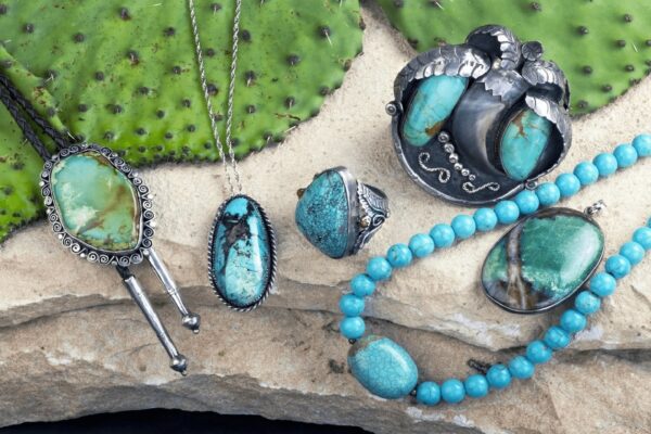 A collection of turquoise jewelry on display.