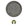 A coin and some gold colored beads on a white background