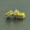 A close up of three beads on a table
