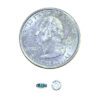 A coin and some small electronics on top of it