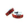 A pair of red and silver rings sitting next to each other.