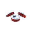 A set of three red beads sitting on top of a table.