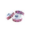 A pair of pink and purple beads sitting on top of each other.