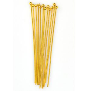 A group of yellow plastic toothpicks on top of each other.