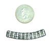 A coin and some rhinestones on a white background