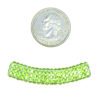A coin and some beads are next to each other