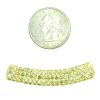 A small coin and some yellow beads