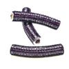 A purple bead is sitting on top of the other beads.