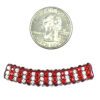 A close up of a coin and some beads
