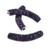 A purple bead is sitting on top of the white beads.