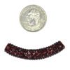 A bead is shown next to a penny for scale.
