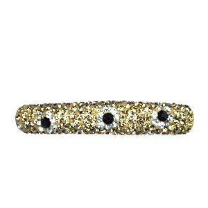 A gold and black bracelet with three eyes.