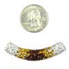 A bead is shown next to the coin.