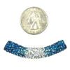 A blue and white bead is shown next to a penny for scale.