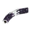 A purple and silver pipe with some white writing