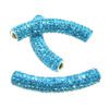 A pair of blue beads are sitting on top of each other.