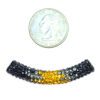 A small coin and some beads next to each other