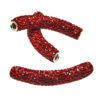 A pair of red and black beads are on the end of a stick.