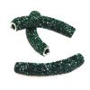 A pair of green beads with white accents.