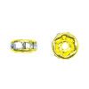 A pair of yellow and white beads sitting next to each other.
