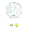 A coin and some gold colored beads