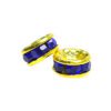 A pair of blue and gold beads sitting next to each other.
