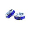 A pair of blue and silver earrings sitting next to each other.