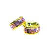 A pair of purple and yellow earrings sitting on top of a white surface.