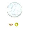 A penny sitting next to a coin and some other items
