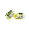 A pair of gold colored metal rings with white stones.