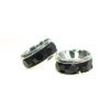 A pair of black and silver rings sitting next to each other.