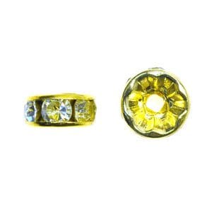 A pair of yellow and clear beads sitting next to each other.