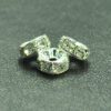 A close up of three beads on a table