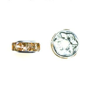 A pair of gold and white rings sitting next to each other.