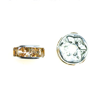 A pair of gold and white rings sitting next to each other.