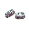 A pair of purple and silver rings sitting next to each other.