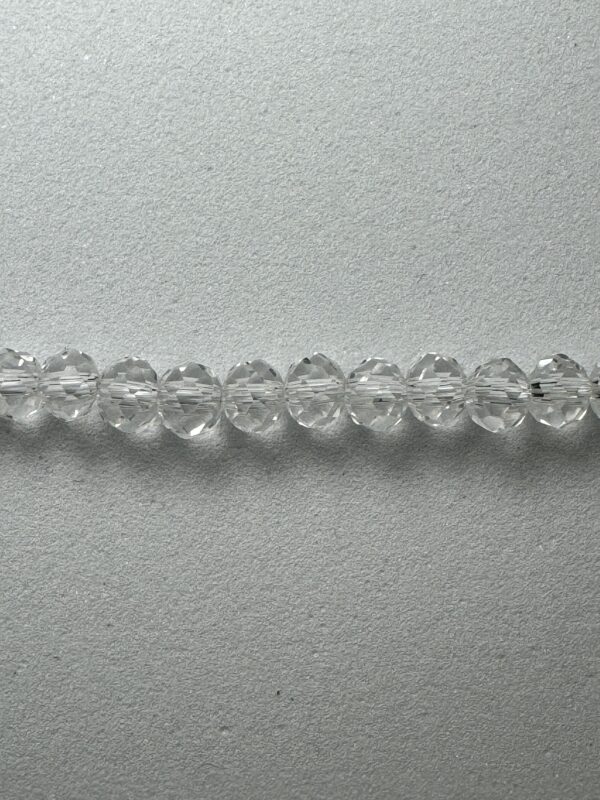 A line of 4RL1 beads on a gray background.