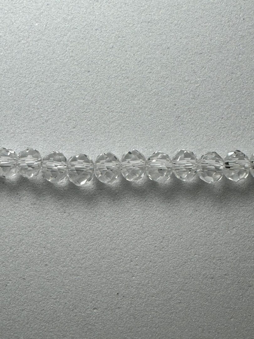 A line of 4RL1 beads on a gray background.