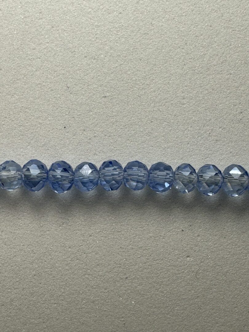 Row of light blue crystal beads.