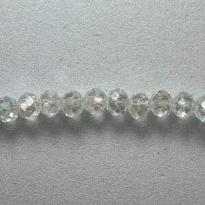 Row of clear faceted glass beads.