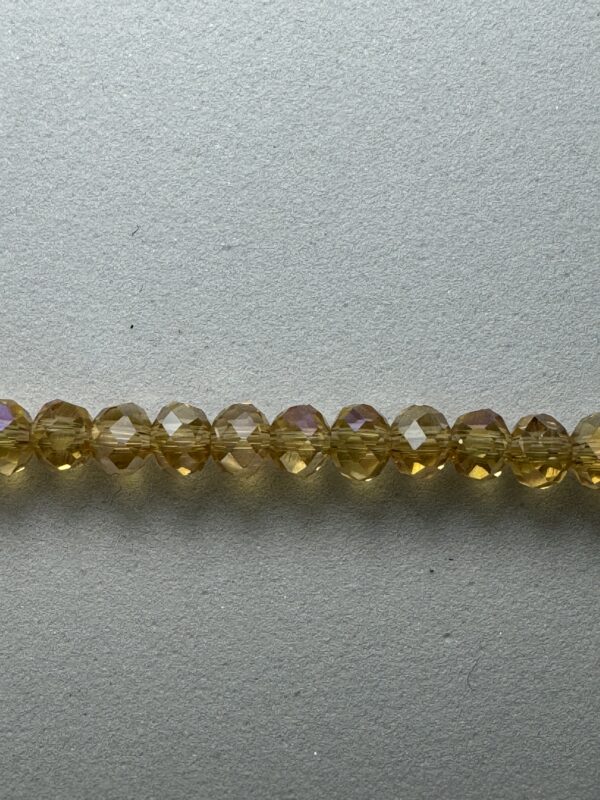 Row of golden iridescent beads.