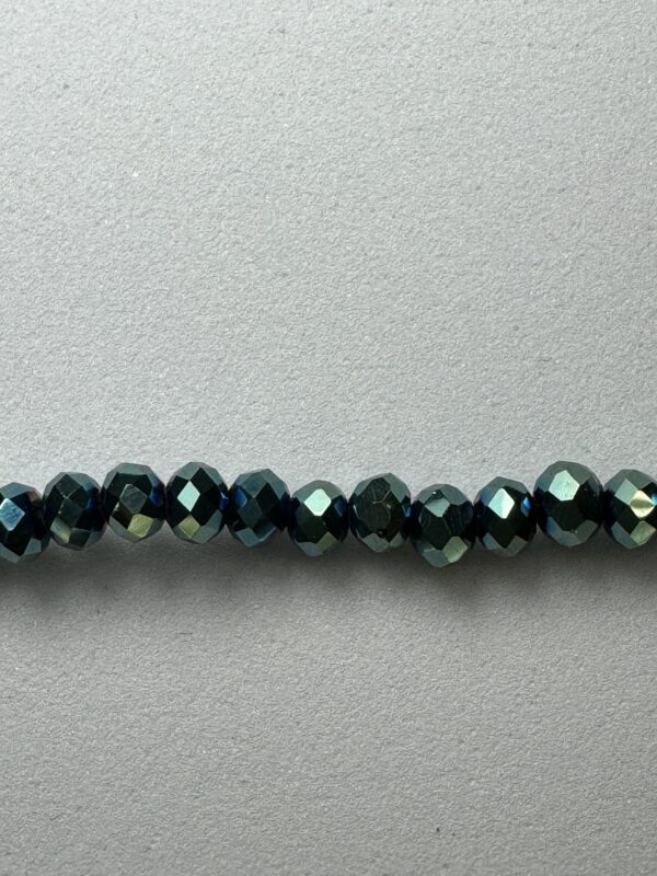 Row of dark blue iridescent beads.