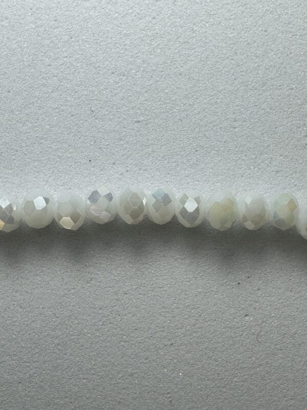 Row of iridescent white beads.