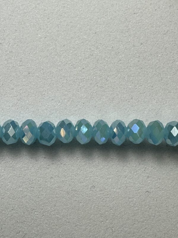 Row of blue iridescent beads.