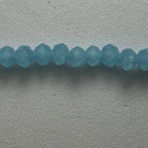 Row of light blue faceted beads.