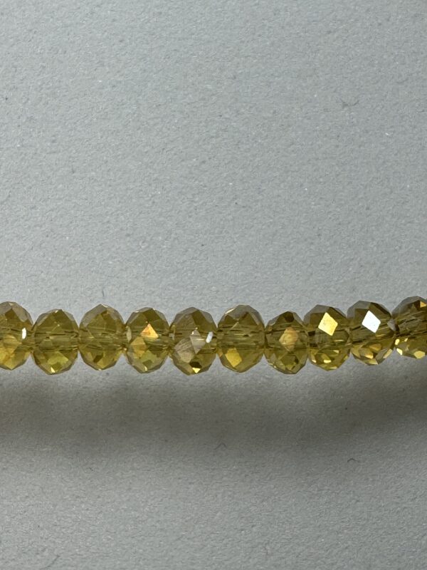 Row of gold-toned glass beads.