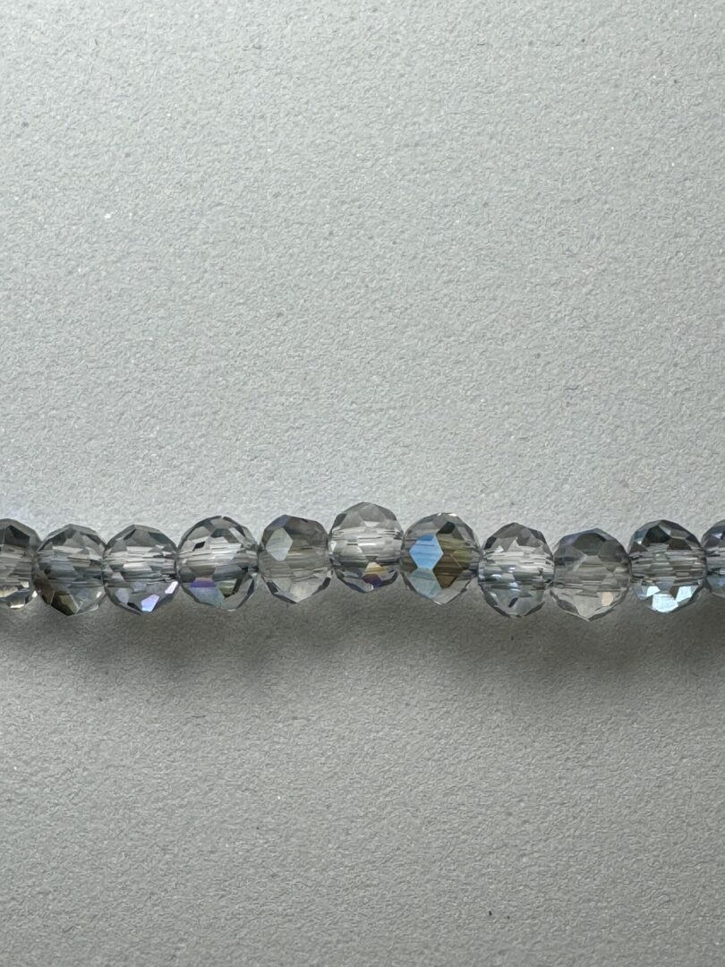 Row of iridescent glass beads.