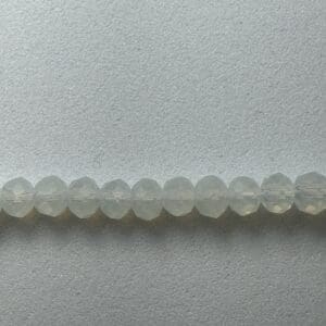 Row of light green faceted beads.