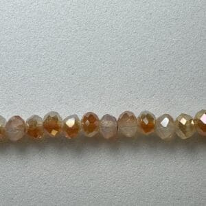 Row of iridescent brown glass beads.