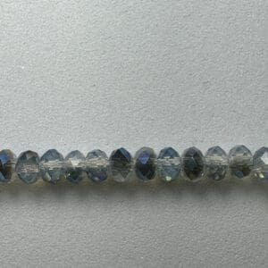 Row of iridescent faceted glass beads.